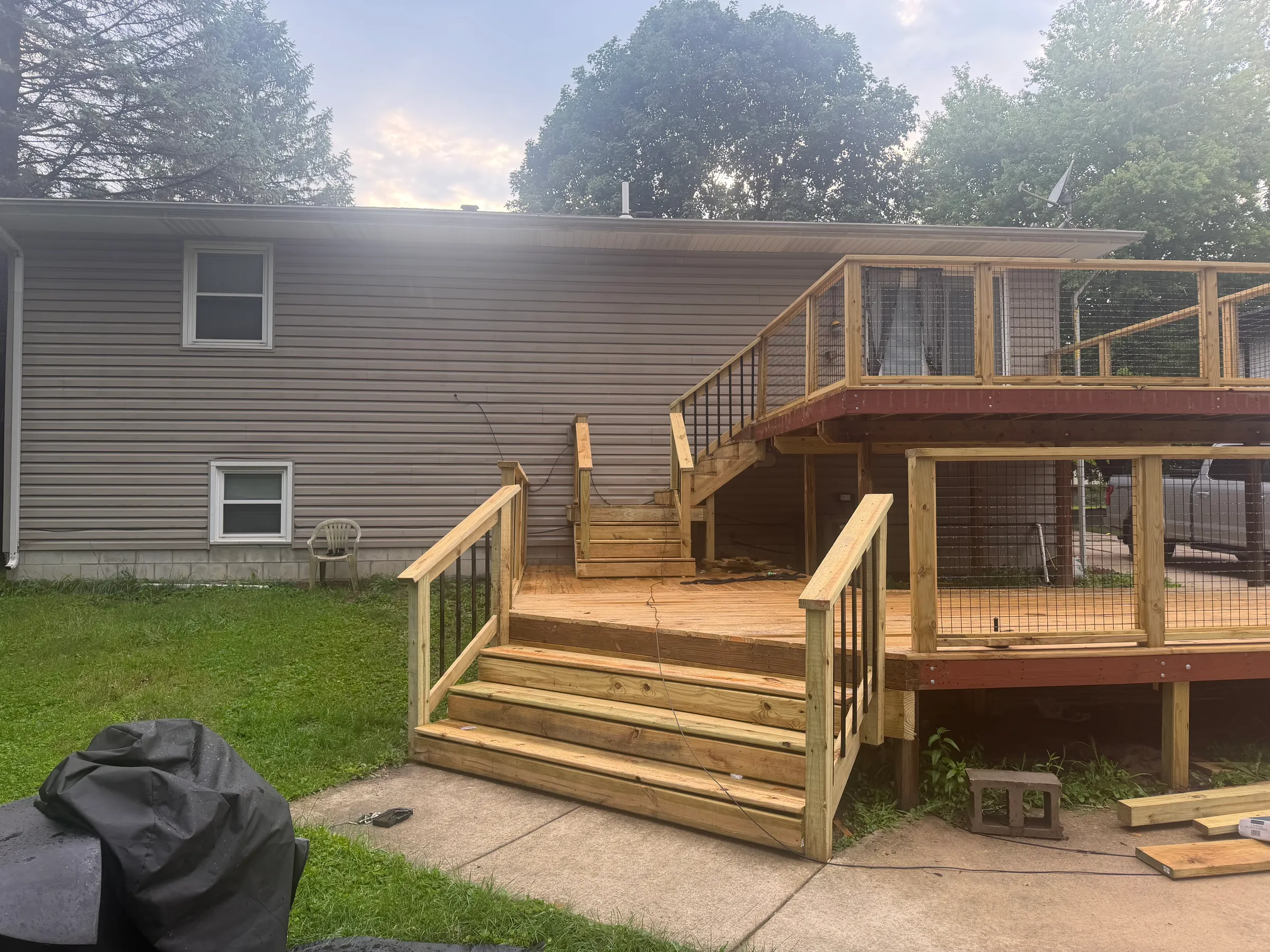 Wide view of completed roof showing uniform shingle pattern, proper ridge cap installation, sealed valleys, and complete coverage with seamless color and texture match across entire roof plane.