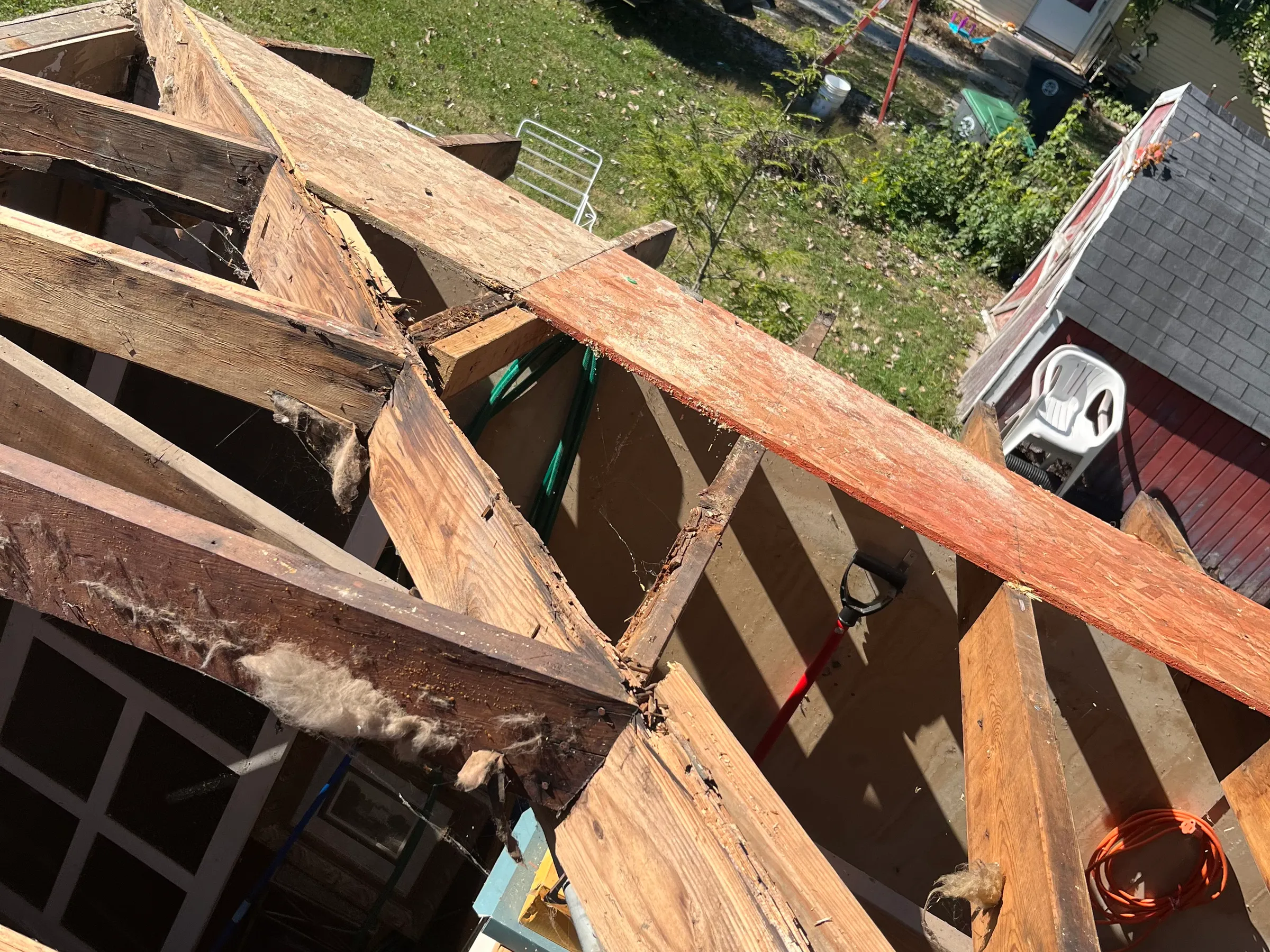 Roofline detail showing shingle alignment, proper nail placement, sealed seams, and integrated flashing work with complete roof coverage and professional finish quality throughout visible section.